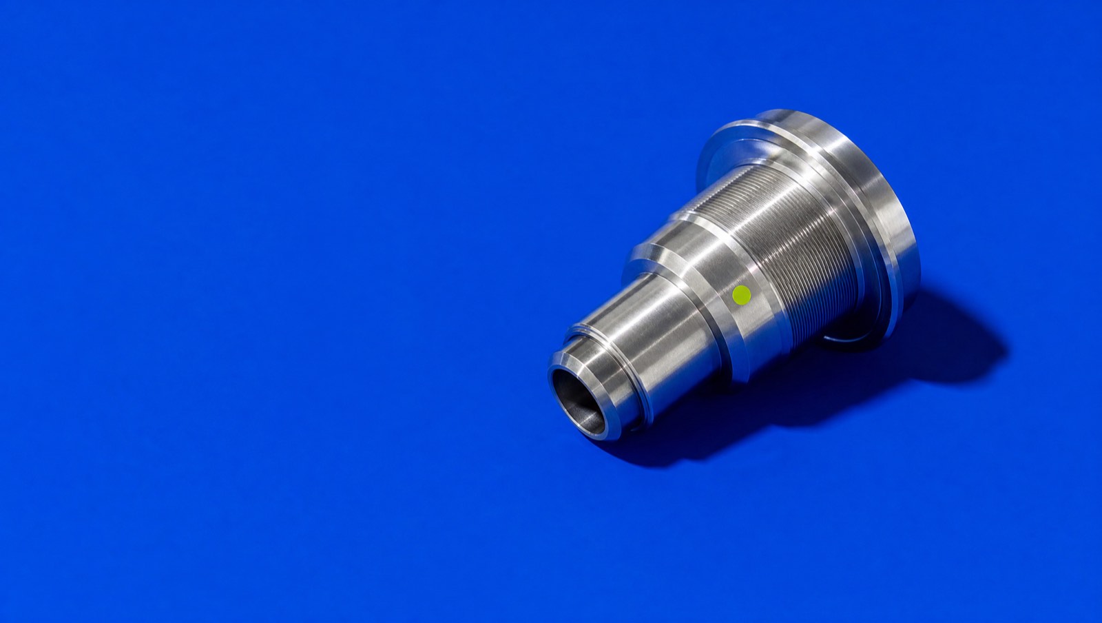 A machined steel component against a saturated cobalt field